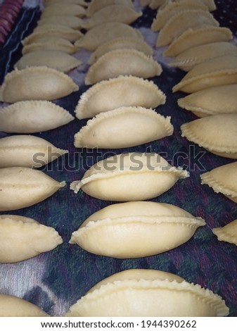 Gujiya Closeup Photos Pedakiya Karanji or Kajjikayalu Pictures in Telugu is a sweet deep fried Dumpling native to the Indian subcontinent Dessert made on the special occasion of Holi Teej and Diwali