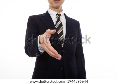 A business person in a suit seeking cooperation in a business negotiation