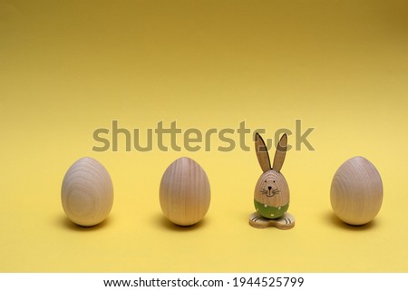 Banner with the wooden eggs and Easter bunny