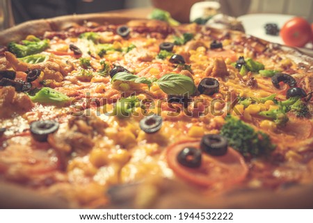 Close-up of an italian pizza with ingredients. Selective focus
