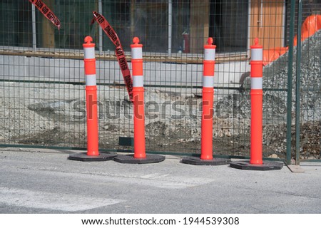 A picture of the pylons on the street.     