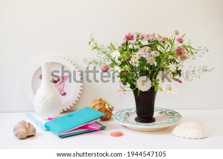 Still life with flowers. Details of the room decoration. Female desktop.