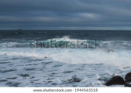 Powerful Waves crushing on a rocky beach.