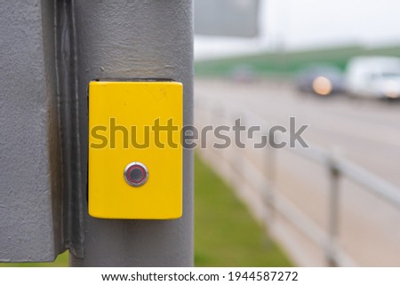 Button for turning on the barrier. To cross the road, press the button. Vandal-proof traffic light.