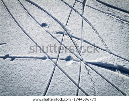 Closeup picture of snow on ice after ice-skating 