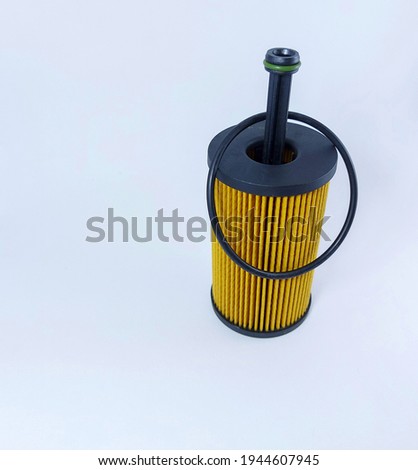 spare engine lubricating oil filter for vehicle cars and truck on white background for cutout and copy space