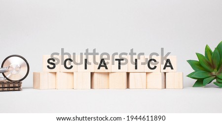 SCIATICA word made with wooden blocks concept