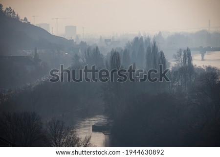 Podoli quarter in Winter haze by Moldau river in Prague, Czech republic