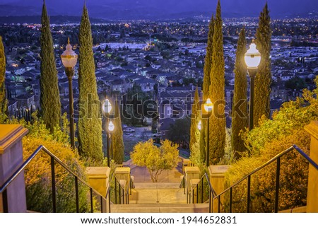 Famous San Jose Landmark at Bright Lamps Overlooking Dark Suburban Suburbs at Twilight
