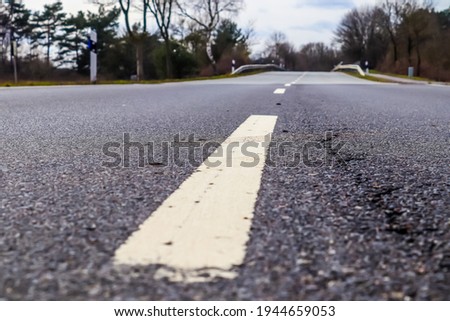 A closeup shot of a road in the countryside