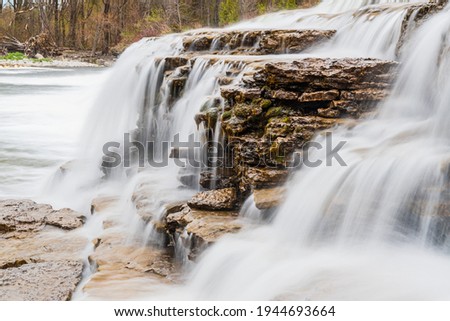Healey Falls Havelock Ontario Canada in early spring, wide step waterfalls with dam