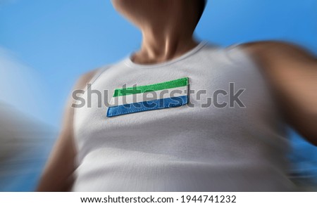The national flag of Sierra Leone on the athlete's chest
