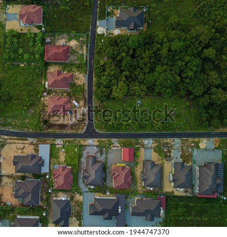 Drone shot of residential area with many houses from top view in Tanah Merah, Kelantan, Malaysia.