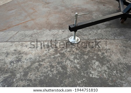 Adjustable Foot use on concrete floor with copy space text