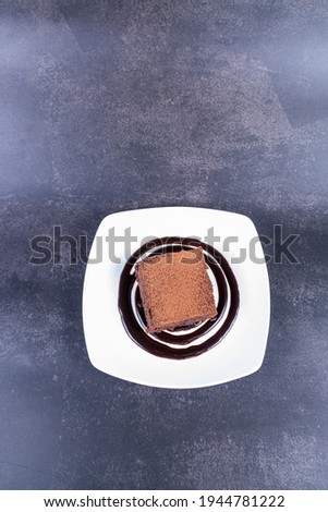 Homemade fudgy chocolate brownies on grey background. chocolate walnut brownie cake still life