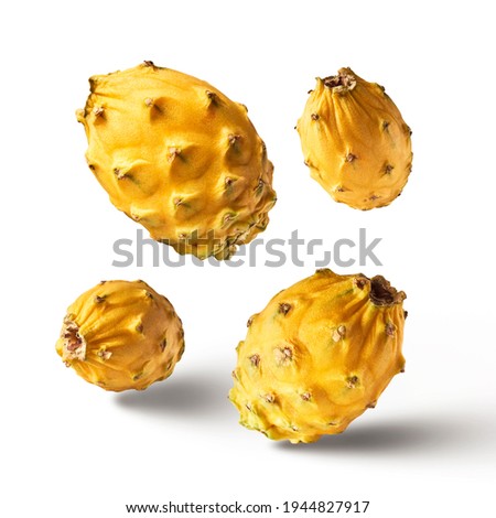 creative image with fresh yellow dragon fruit or pitaya falling in the air isolated on white backround., levitation or  zero gravity food conception. High resolution image