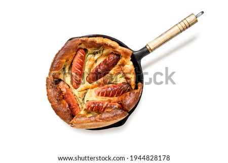 Toad in the hole, Sausage Toad, traditional English dish of sausages in Yorkshire pudding batter. isolated on white background