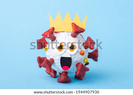 Scared Covid-19 cell with an open mouth and a crown on its head looking to the camera. Funny frightened coronavirus cell afraid of the vaccination
