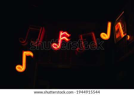 Music neon sign on dark background