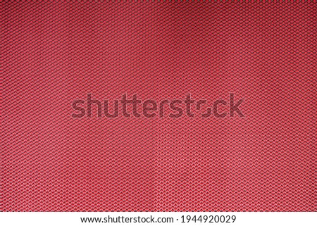 Abstract closeup of metallic background with colour background
