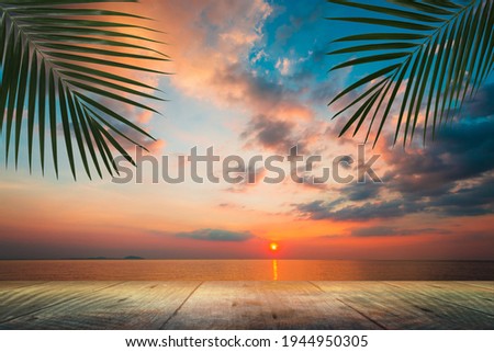 Wood table empty with sunset  beautiful sky on the beach, Copy space 