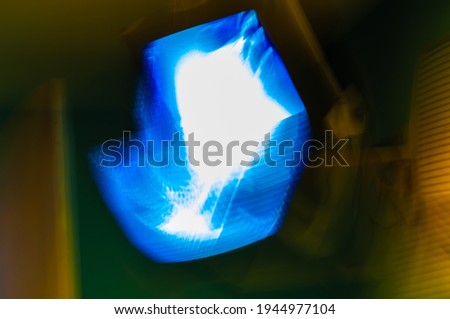 Abstract colorful blurred background with defocused lights and shadows creating unprecedented shapes and textures.