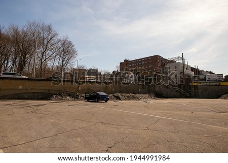 These are photos of an empty parking lot.  Royalty-Free Stock Photo #1944991984