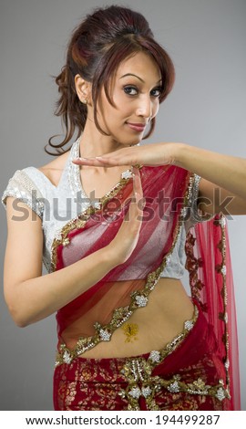 Young Indian woman making time out signal with hands