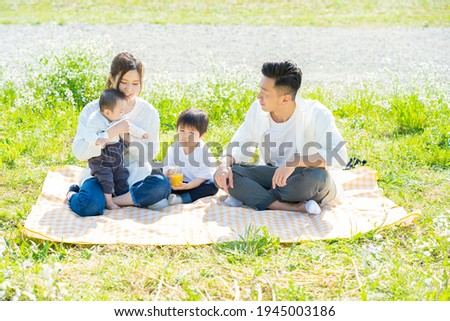 Parents and children enjoying a picnic