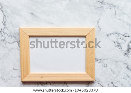 wooden frame mock up on marble background, modern interior. Blank Greeting Card. Mock up for your photo or text.Place your work, print art,shabby style.