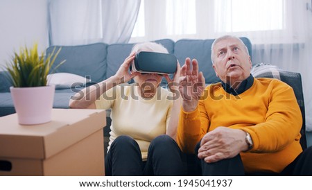 Old people using new headset goggles trends technology . High quality photo