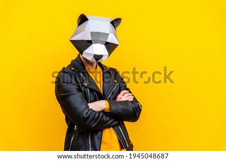 Happy man with funny low poly mask on colored background - Creative conceptual idea for advertising,adult with low-poly origami paper mask doing funny poses Royalty-Free Stock Photo #1945048687