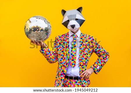 Happy man with funny low poly mask on colored background - Creative conceptual idea for advertising,adult with low-poly origami paper mask doing funny poses