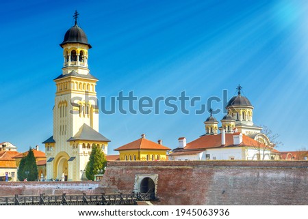 Alba Iulia city in Transylvania, Romania, cityscape with orthoox and catholic cathedral towers