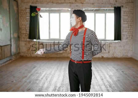 Mime artist, clown with a rose, comedy