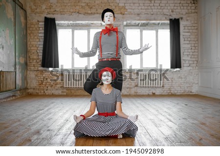Two mime artists, love couple parody scene