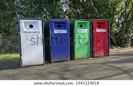 Row of Bottle and plastic Banks Bins in a car park