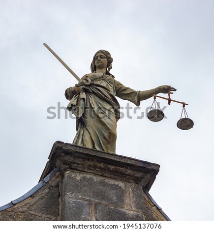 A picture of the justice symbol at the top of the Dublin Castle.