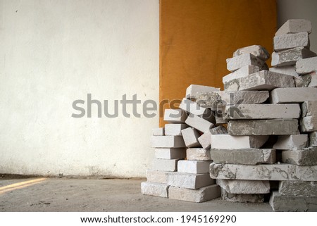 lightweight bricks on the construction site. aerial view of construction worker. space for text