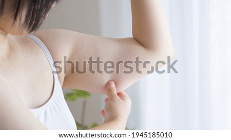 Asian women worried about getting fat Royalty-Free Stock Photo #1945185010