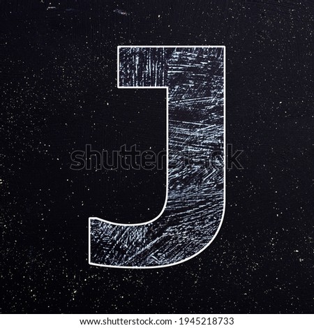 Letter J of the alphabet written with chalk