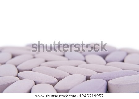 Purple pills on a white background. Medicine. High quality photo
