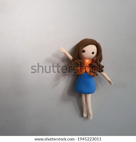 Clay girl doll with white background
