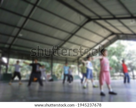 Defocused Abstract Background of People Practice Martial Arts