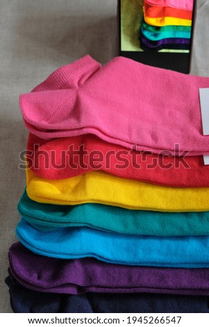 Rainbow colors socks. Clothing subscription. Vertical image. 