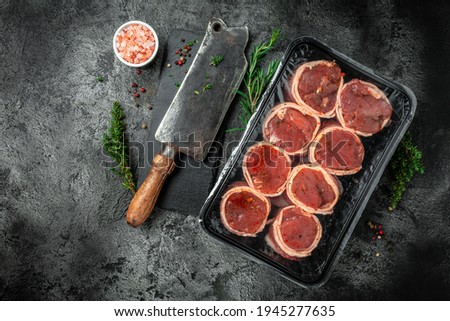fresh raw fillet minion steaks wrapped in bacon. Meat products in packed. beef tenderloin steak. The concept of the recipe, filet Mignon. meat semi finished product.