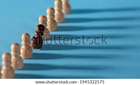 chess pieces in a row, white pawns on a blue background,