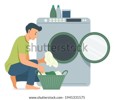 Man Wash the Clothes with Washing Machine. Royalty-Free Stock Photo #1945331575