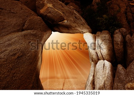 Empty cave on the mountain with light flare, Background for easter.