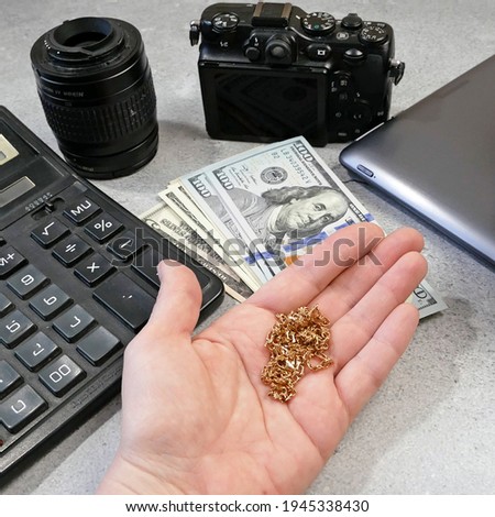 golden chain, digital camera and money, store selling photographic equipment, pawnshop, closeup